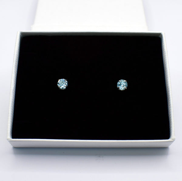 Sterling Silver Blue Topaz Claw Set Stud Earrings